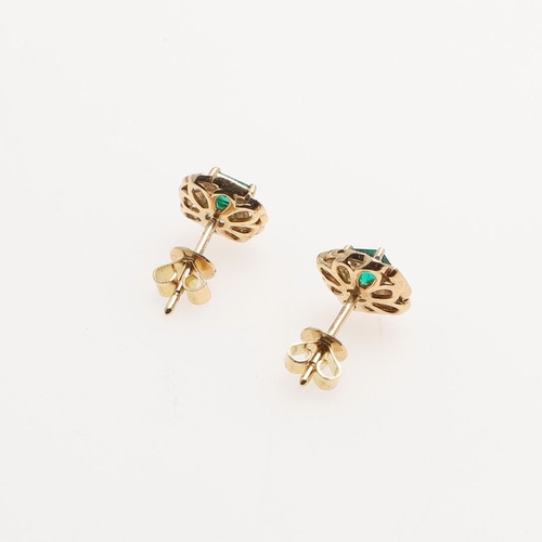 1025 - A PAIR OF EMERALD AND DIAMOND CLUSTER STUD EARRINGS. each earring set with a square-shaped emerald w... 