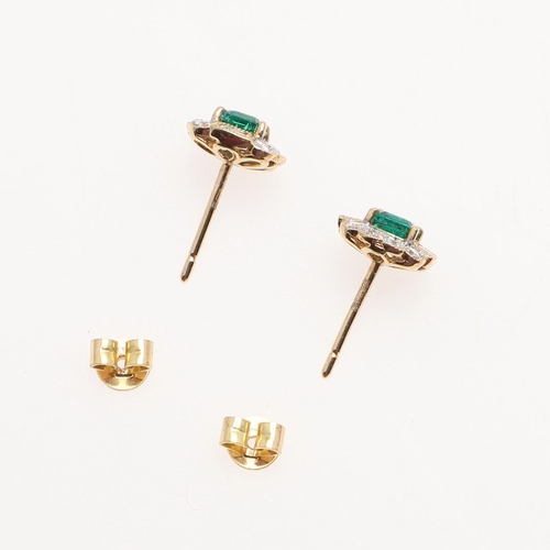 1025 - A PAIR OF EMERALD AND DIAMOND CLUSTER STUD EARRINGS. each earring set with a square-shaped emerald w... 