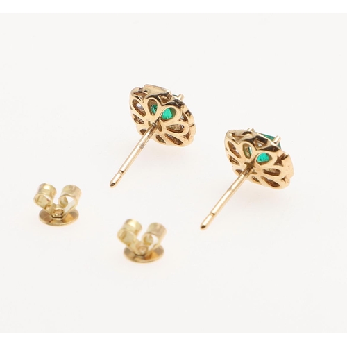 1025 - A PAIR OF EMERALD AND DIAMOND CLUSTER STUD EARRINGS. each earring set with a square-shaped emerald w... 