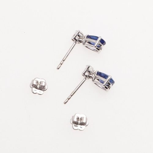 1026 - A PAIR OF SAPPHIRE AND DIAMOND DROP EARRINGS. each earring mounted with a pear-shaped sapphire drop ... 