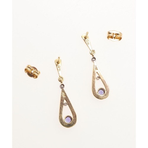 1028 - CATHERINE BEST. A PAIR OF TANZANITE DIAMOND AND 18CT GOLD DROP EARRINGS. each earring set with a cir... 