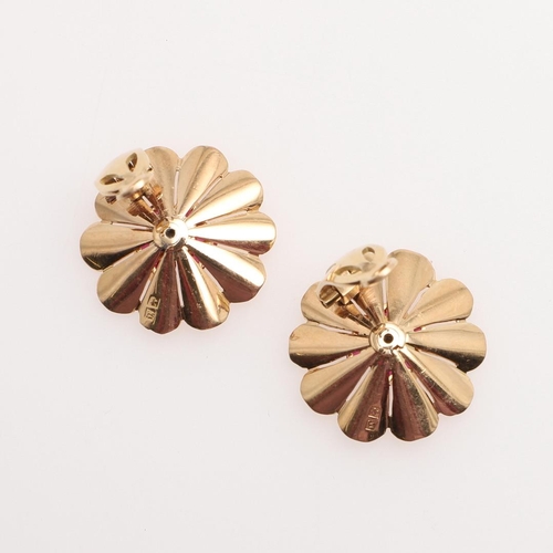 1050 - A PAIR OF RETRO GOLD, RUBY AND DIAMOND FLOWERHEAD CLIP EARRINGS, CIRCA 1940. each gold flowerhead ce... 