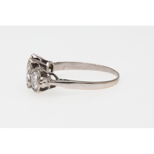 1054 - A DIAMOND THREE STONE RING. mounted with three graduated circular-cut diamonds, in 18ct white gold, ... 