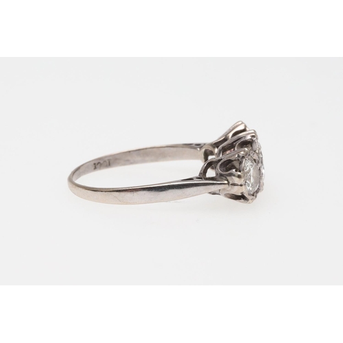 1054 - A DIAMOND THREE STONE RING. mounted with three graduated circular-cut diamonds, in 18ct white gold, ... 