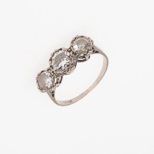 1054 - A DIAMOND THREE STONE RING. mounted with three graduated circular-cut diamonds, in 18ct white gold, ... 