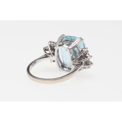 1056 - AN AQUAMARINE AND DIAMOND RING. the oval-shaped aquamarine is set with five circular-cut diamonds to... 