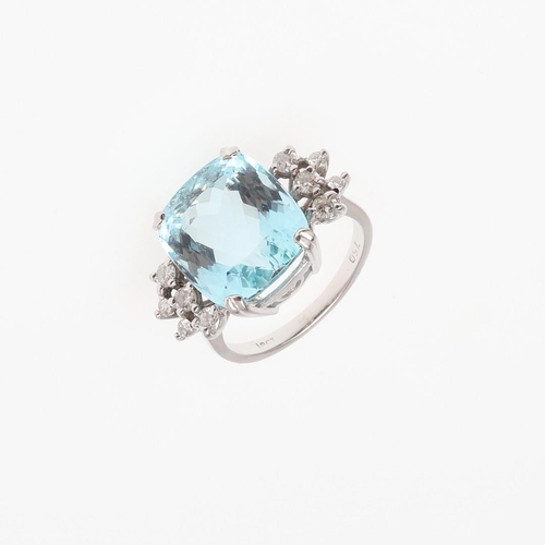 1056 - AN AQUAMARINE AND DIAMOND RING. the oval-shaped aquamarine is set with five circular-cut diamonds to... 