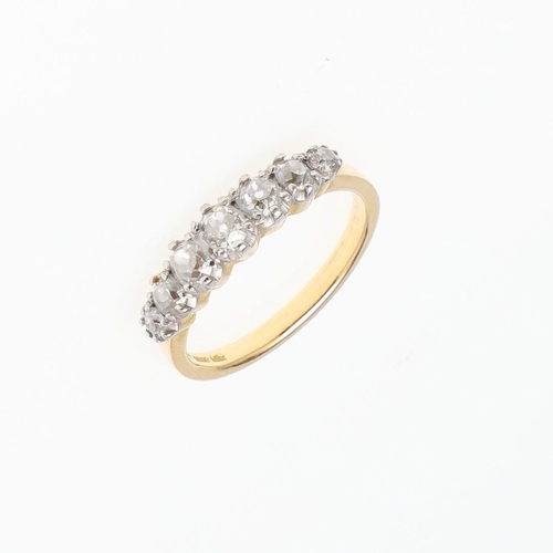 1060 - A DIAMOND HALF HOOP RING. mounted with seven circular old-cut diamonds, in 18ct gold, 5.2 grams. Siz... 