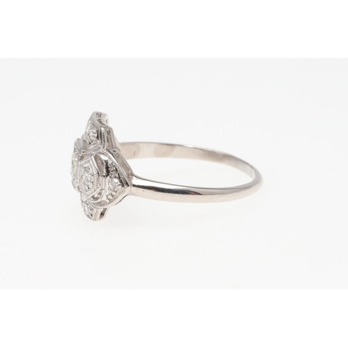 1064 - A DIAMOND CLUSTER RING. mounted overall with old-cut and single-cut diamonds, in platinum, 3.8 grams... 