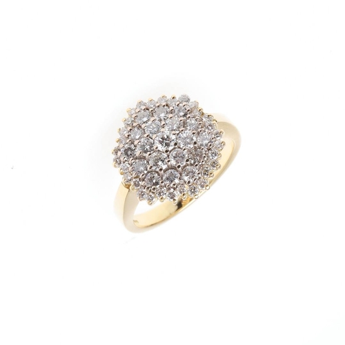 1070 - A DIAMOND CLUSTER RING. mounted with circular-cut diamonds, in 18ct yellow gold, 9.1 grams. Size T.