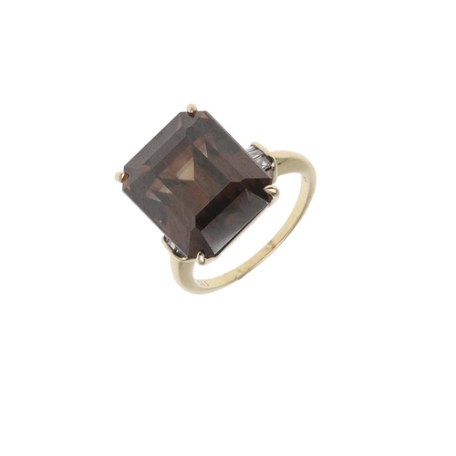 1072 - A ZIRCON AND DIAMOND RING. the step-cut brown zircon is set with three baguette-cut diamonds to each... 