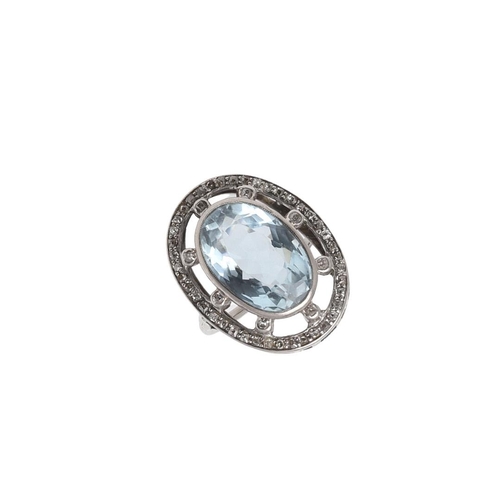 1077 - AN AQUAMARINE AND DIAMOND RING. the oval-shaped aquamarine is set within an openwork surround of cir... 