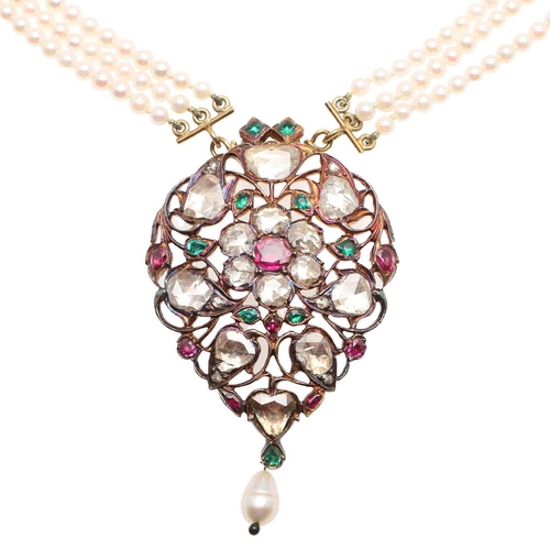 1116 - A 19TH CENTURY INDIAN DIAMOND, RUBY AND EMERALD PENDANT. the openwork gold pendant is centred with a... 