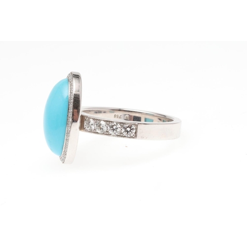 1119 - A TURQUOISE AND DIAMOND CLUSTER RING. the oval-shaped turquoise cabochon is set within a surround of... 