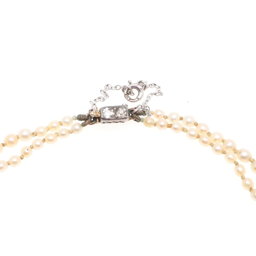 1121 - A DOUBLE ROW GRADUATED NATURAL PEARL NECKLACE. the pearls graduate from approximately 2.3 to 6.9mm a... 