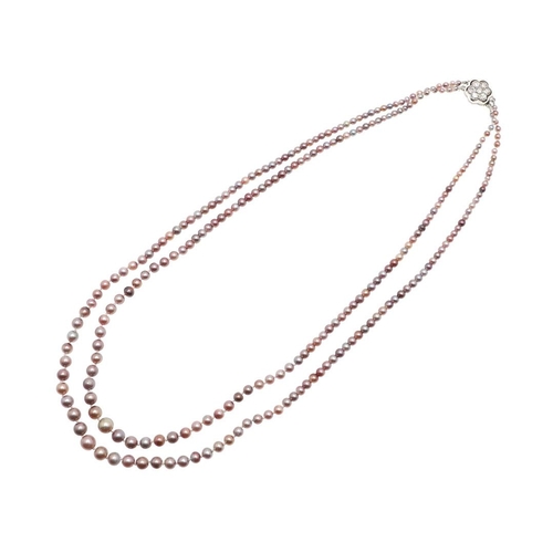 1122 - A GRADUATED DOUBLE ROW NATURAL PEARL NECKLACE. the pearls graduate from approximately 2.0 to 5.6mm a... 