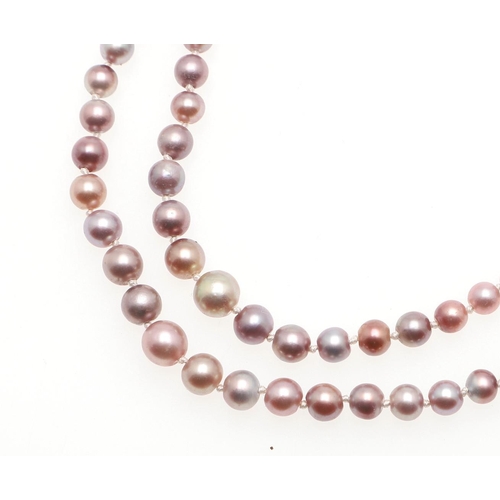 1122 - A GRADUATED DOUBLE ROW NATURAL PEARL NECKLACE. the pearls graduate from approximately 2.0 to 5.6mm a... 