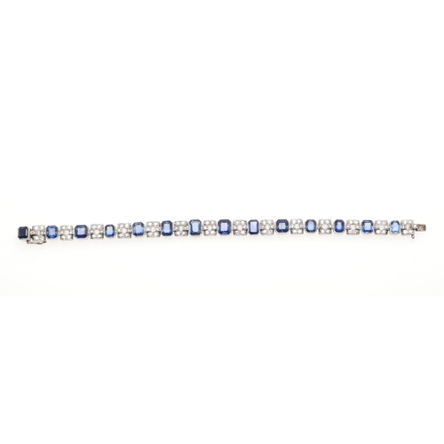 1126 - AN ART DECO SAPPHIRE AND DIAMOND BRACELET. mounted alternately with octagonal-shaped sapphires and m... 