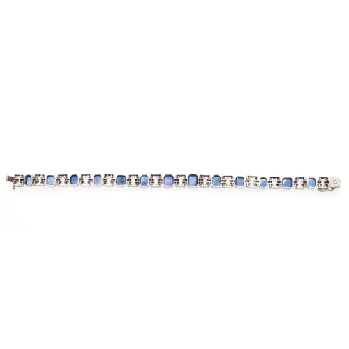 1126 - AN ART DECO SAPPHIRE AND DIAMOND BRACELET. mounted alternately with octagonal-shaped sapphires and m... 