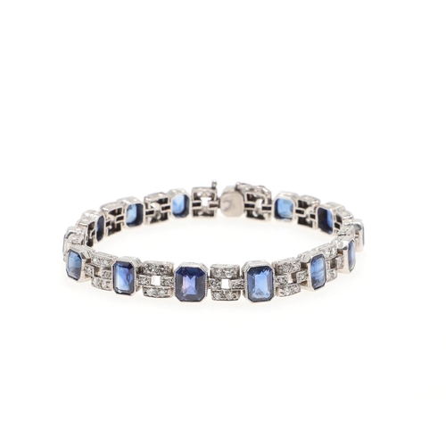 1126 - AN ART DECO SAPPHIRE AND DIAMOND BRACELET. mounted alternately with octagonal-shaped sapphires and m... 