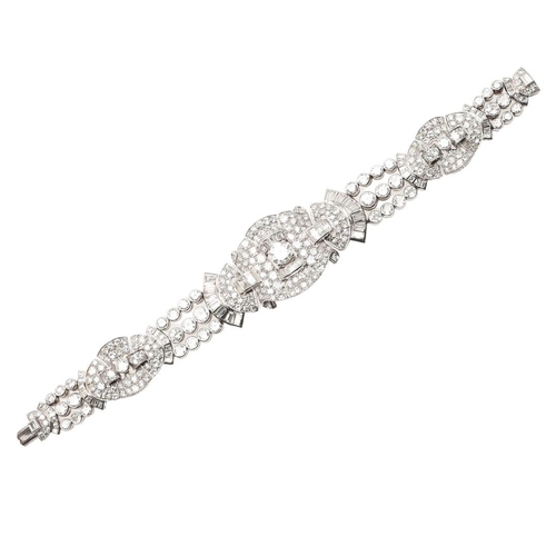 1127 - AN ART DECO DIAMOND BRACELET. formed with geometric and fan-shaped sections, mounted overall with ci... 