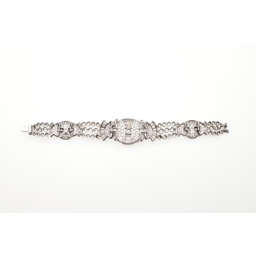 1127 - AN ART DECO DIAMOND BRACELET. formed with geometric and fan-shaped sections, mounted overall with ci... 