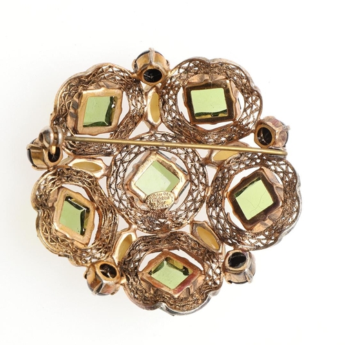 794 - A VINTAGE PASTE AND GILT METAL BROOCH BY CHRISTIAN DIOR. mounted with square-shaped green paste ston... 