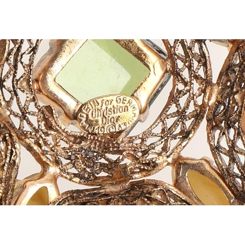 794 - A VINTAGE PASTE AND GILT METAL BROOCH BY CHRISTIAN DIOR. mounted with square-shaped green paste ston... 