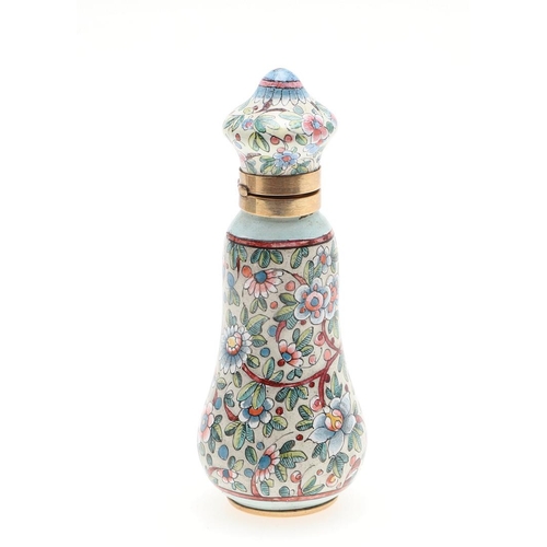 797 - AN ENAMEL AND GOLD SCENT BOTTLE. With foliate enamel decoration, 7.5cm high, 55.0 grams, in fitted c... 