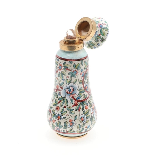 797 - AN ENAMEL AND GOLD SCENT BOTTLE. With foliate enamel decoration, 7.5cm high, 55.0 grams, in fitted c... 