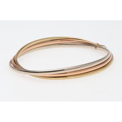 802 - A 15CT GOLD HALF HINGED BANGLE. of oval shape and plain form, internal measurements 5 x 6.2cm., 8.3 ... 