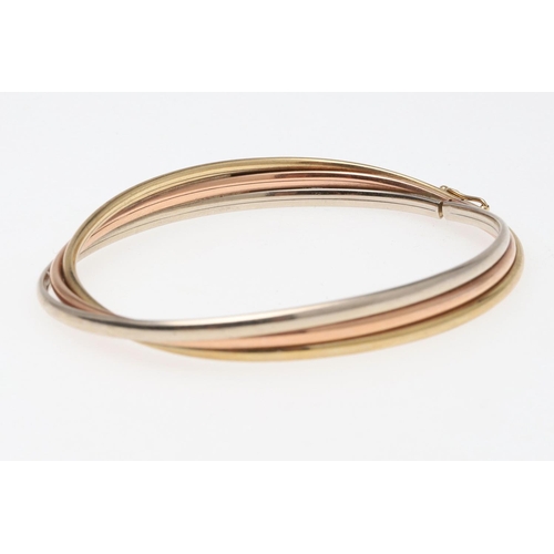 802 - A 15CT GOLD HALF HINGED BANGLE. of oval shape and plain form, internal measurements 5 x 6.2cm., 8.3 ... 