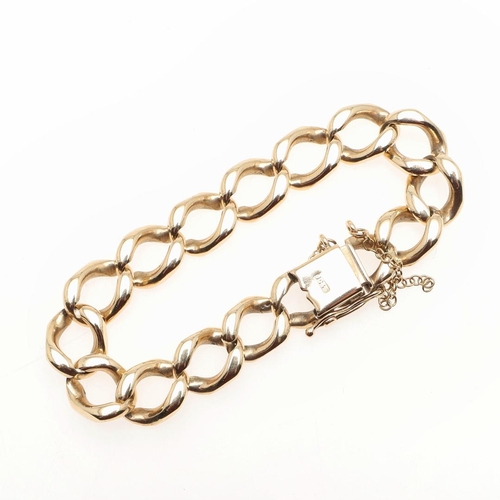 803 - A 9CT GOLD CURB LINK BRACELET. with concealed clasp, 18.5cm long, 44.0 grams.