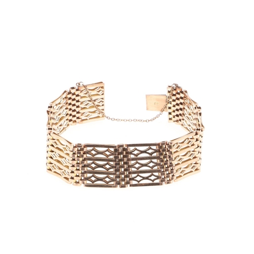 820 - A 9CT GOLD FANCY GATE LINK BRACELET. with concealed clasp, 18.5cm long, 28.1 grams.