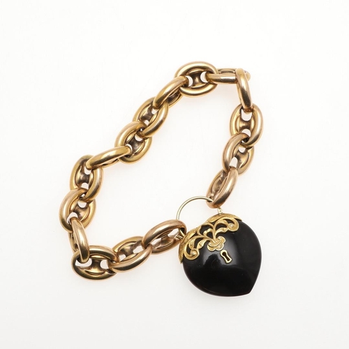 821 - A GOLD FANCY LINK BRACELET. the heart-shaped black onyx clasp with applied gold decoration, 23.0cm l... 