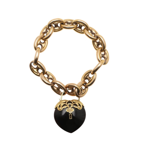 821 - A GOLD FANCY LINK BRACELET. the heart-shaped black onyx clasp with applied gold decoration, 23.0cm l... 