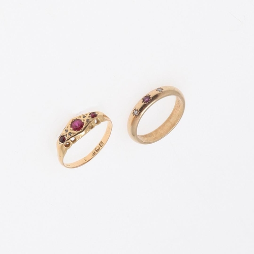 839 - A RUBY AND DIAMOND RING. mounted with three circular-cut rubies and four small diamonds, in 18ct gol... 