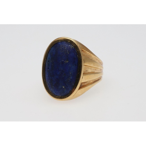 848 - A GENTLEMAN'S LAPIS LAZULI AND 18CT GOLD SIGNET RING. mounted with an oval-shaped section of lapis l... 