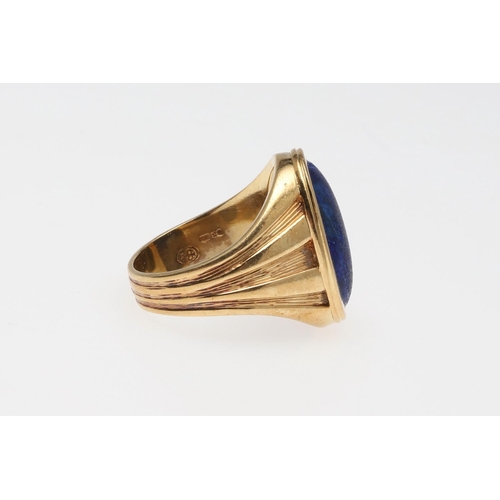 848 - A GENTLEMAN'S LAPIS LAZULI AND 18CT GOLD SIGNET RING. mounted with an oval-shaped section of lapis l... 