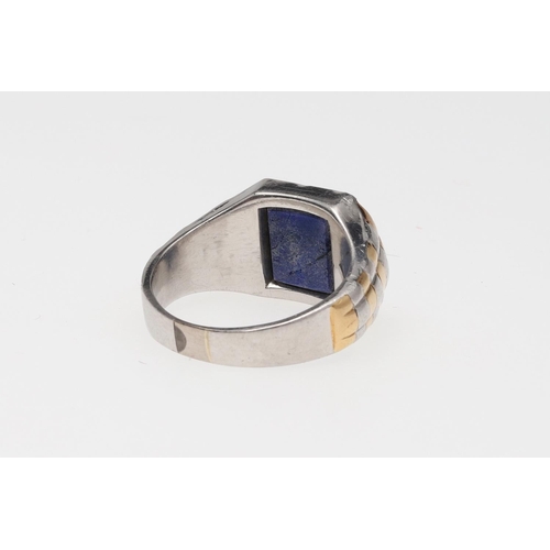 849 - A GENTLEMAN'S 1920'S PLATINUM AND GOLD LAPIS LAZULI SIGNET RING. mounted with a panel of lapis lazul... 