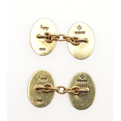 854 - A PAIR OF ENAMEL AND 9CT GOLD CUFFLINKS BY ASPREY. of oval shape, each link with blue and green guil... 