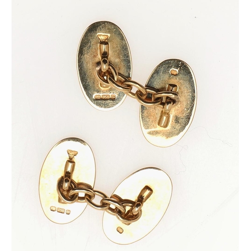 855 - A PAIR OF ENAMEL AND 18CT GOLD CUFFLINKS. of oval shape, each link with green enamel and gold decora... 