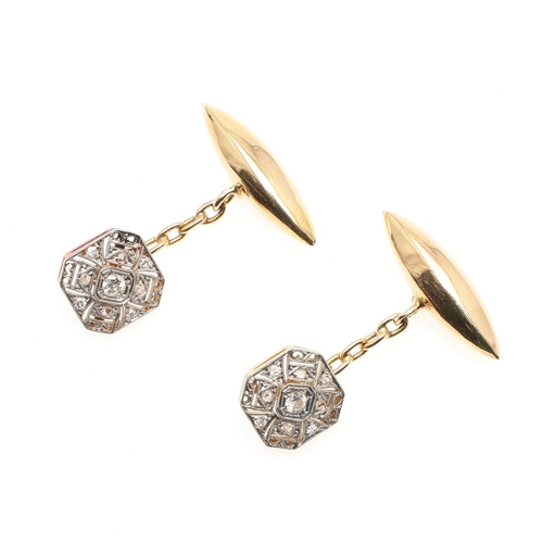 857 - A PAIR OF DIAMOND AND GOLD CUFFLINKS. each openwork octagonal-shaped link is millegrain set with cir... 