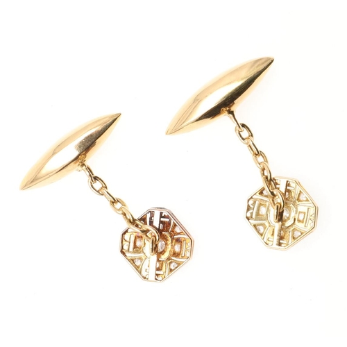 857 - A PAIR OF DIAMOND AND GOLD CUFFLINKS. each openwork octagonal-shaped link is millegrain set with cir... 