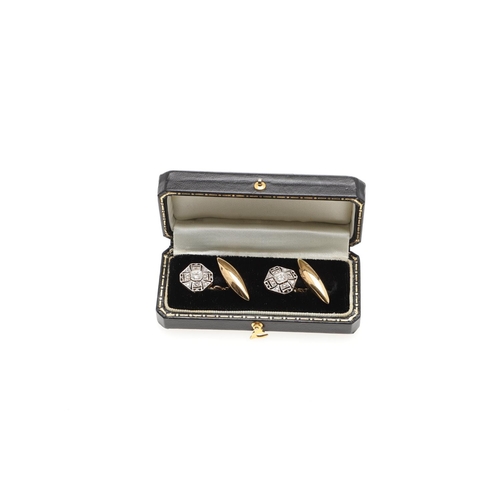 857 - A PAIR OF DIAMOND AND GOLD CUFFLINKS. each openwork octagonal-shaped link is millegrain set with cir... 