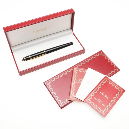 859 - A BLACK FOUNTAIN PEN BY CARTIER. with gold plated decoration, 18ct gold nip, in a red leather box by... 