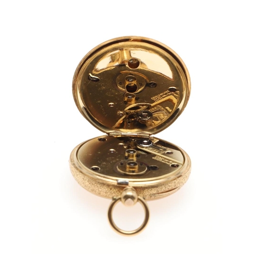 867 - AN 18CT GOLD OPEN FACED POCKET WATCH. the gold foliate dial with Roman numerals, with foliate engrav... 