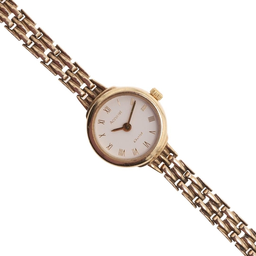 882 - A LADY'S 9CT GOLD WRISTWATCH BY ACCURIST. the signed circular dial with Roman numerals, on a 9ct gol... 