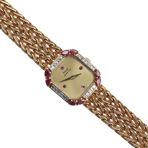 888 - A LADY'S RUBY, DIAMOND AND 18CT GOLD WRISTWATCH BY PIAGET. the signed gold cushion-shaped dial with ... 