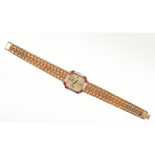 888 - A LADY'S RUBY, DIAMOND AND 18CT GOLD WRISTWATCH BY PIAGET. the signed gold cushion-shaped dial with ... 